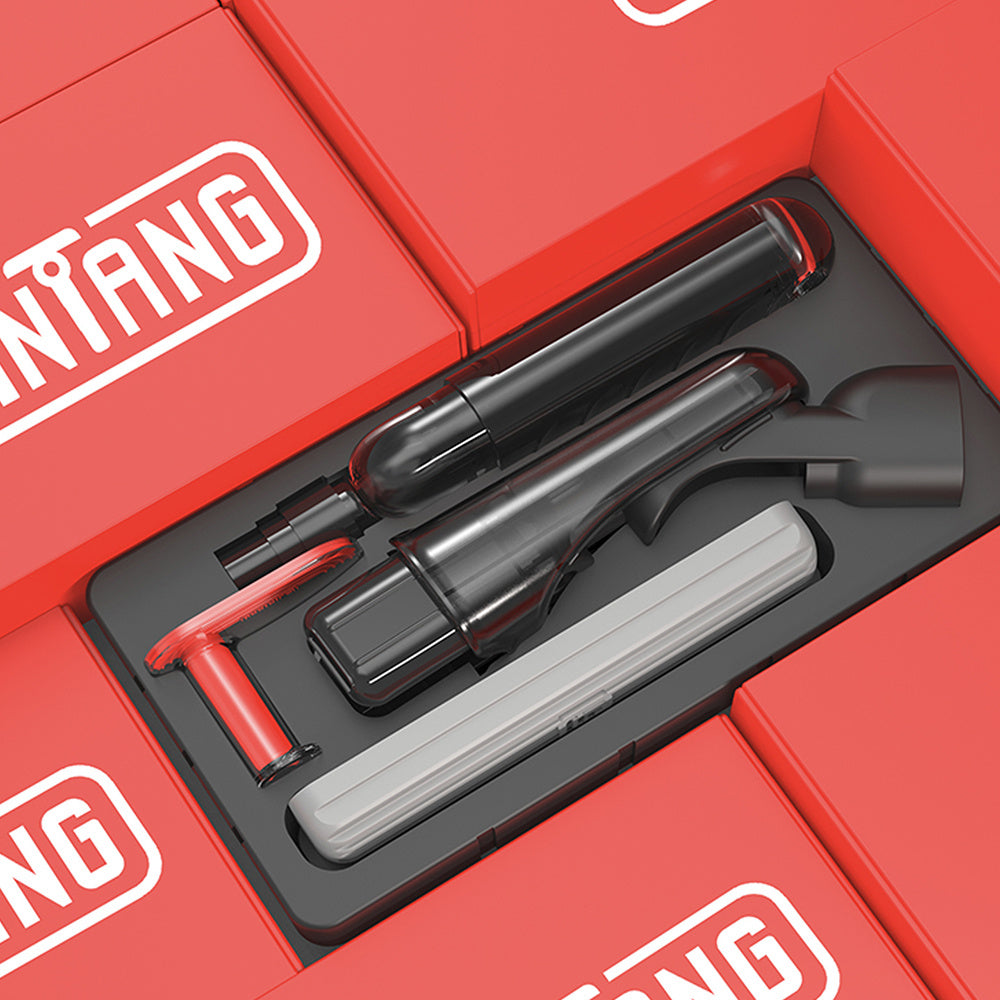 Gray cleaning tool with attachments on a light pink background